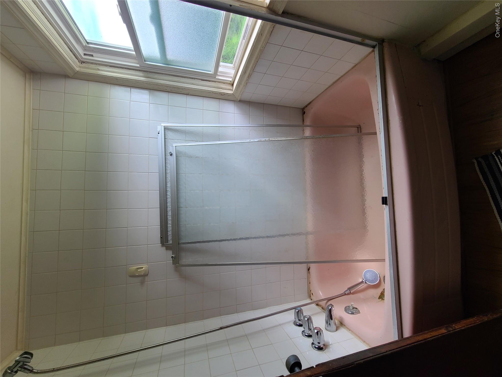 299-301 Stump Pond Road Livingston Manor, NY 12758 - Photo 20 of 50 a bathroom with a bathtub and a shower