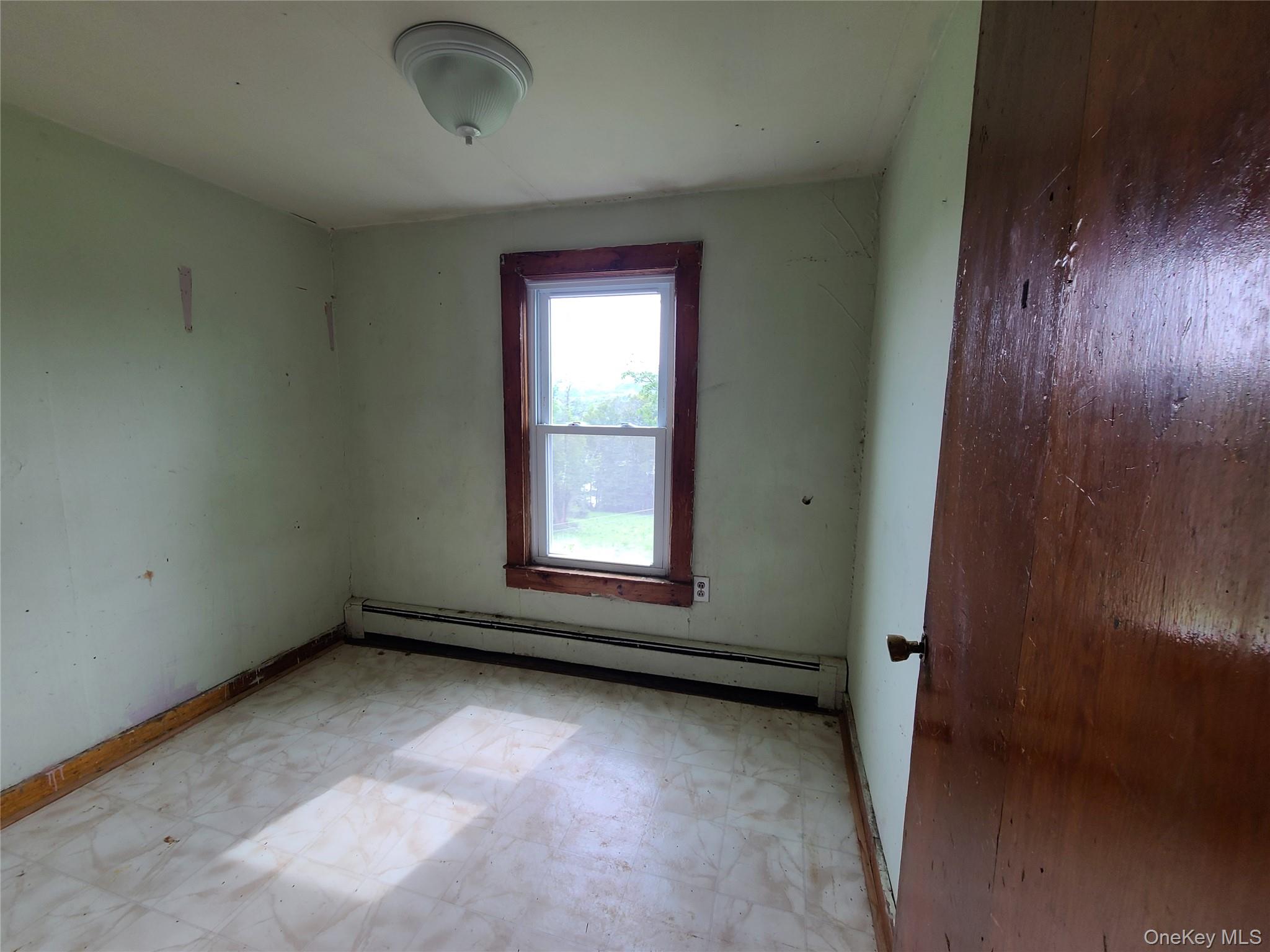 299-301 Stump Pond Road Livingston Manor, NY 12758 - Photo 22 of 50 an empty room with a window