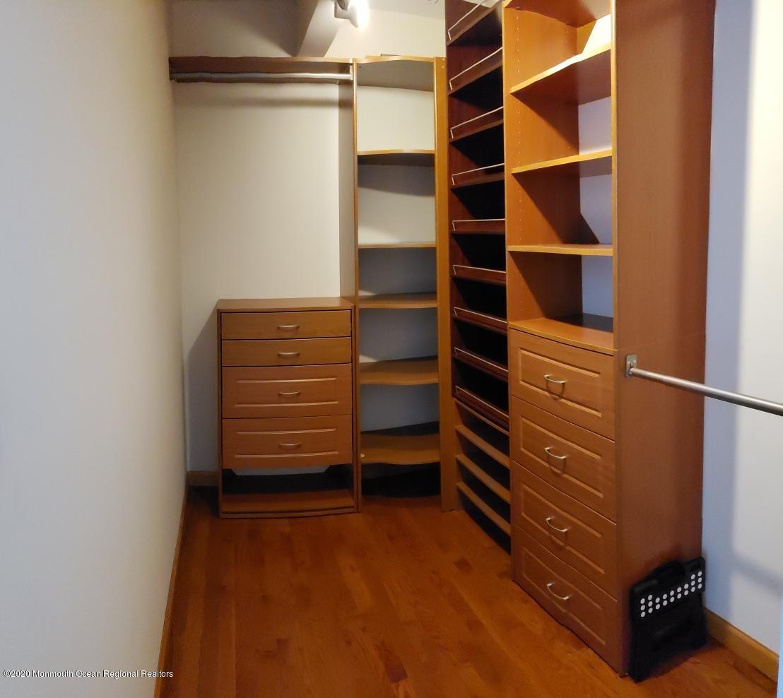 227 Georgia Road Freehold, NJ 07728 - Photo 49 of 79 a view of walk in closet with empty racks