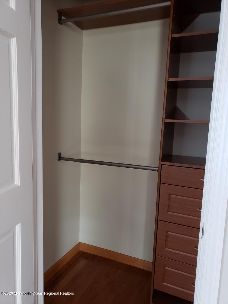 227 Georgia Road Freehold, NJ 07728 - Photo 52 of 79 a view of walk in closet with empty racks