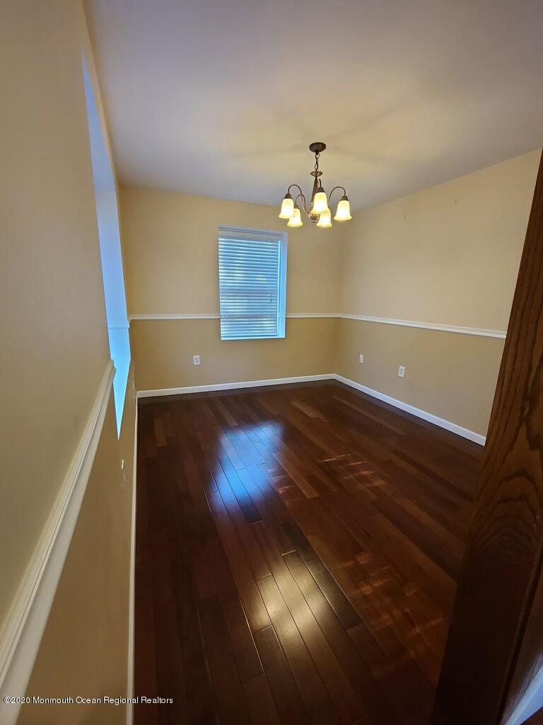 227 Georgia Road Freehold, NJ 07728 - Photo 8 of 79 a view of a room with wooden floor