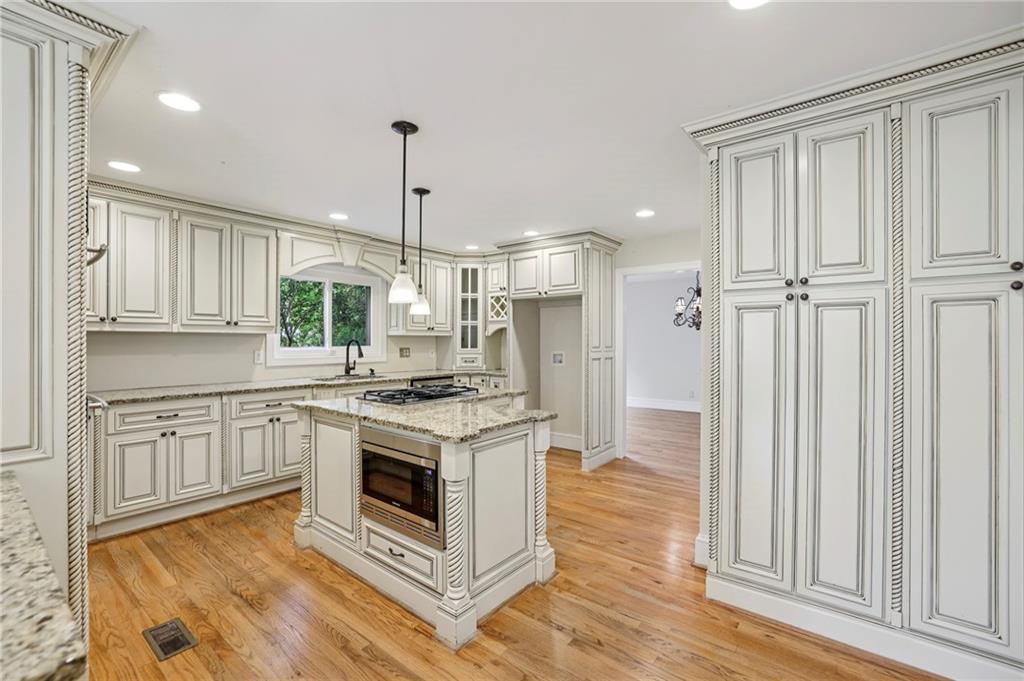 1843 Vancroft Court Atlanta, GA 30338 - Photo 12 of 46 a kitchen with stainless steel appliances granite countertop a stove a sink and a refrigerator