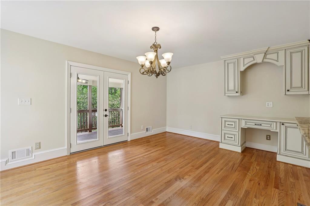 1843 Vancroft Court Atlanta, GA 30338 - Photo 14 of 46 wooden floor in an empty room with a window