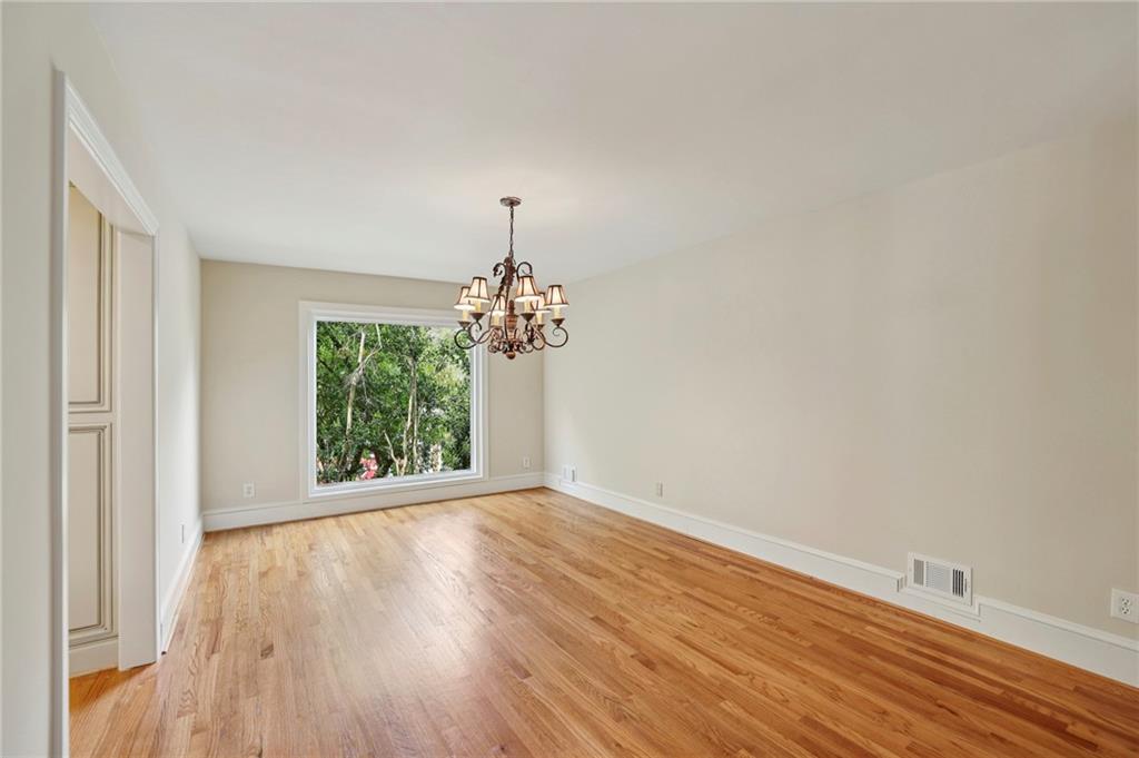 1843 Vancroft Court Atlanta, GA 30338 - Photo 19 of 46 wooden floor in an empty room with a window
