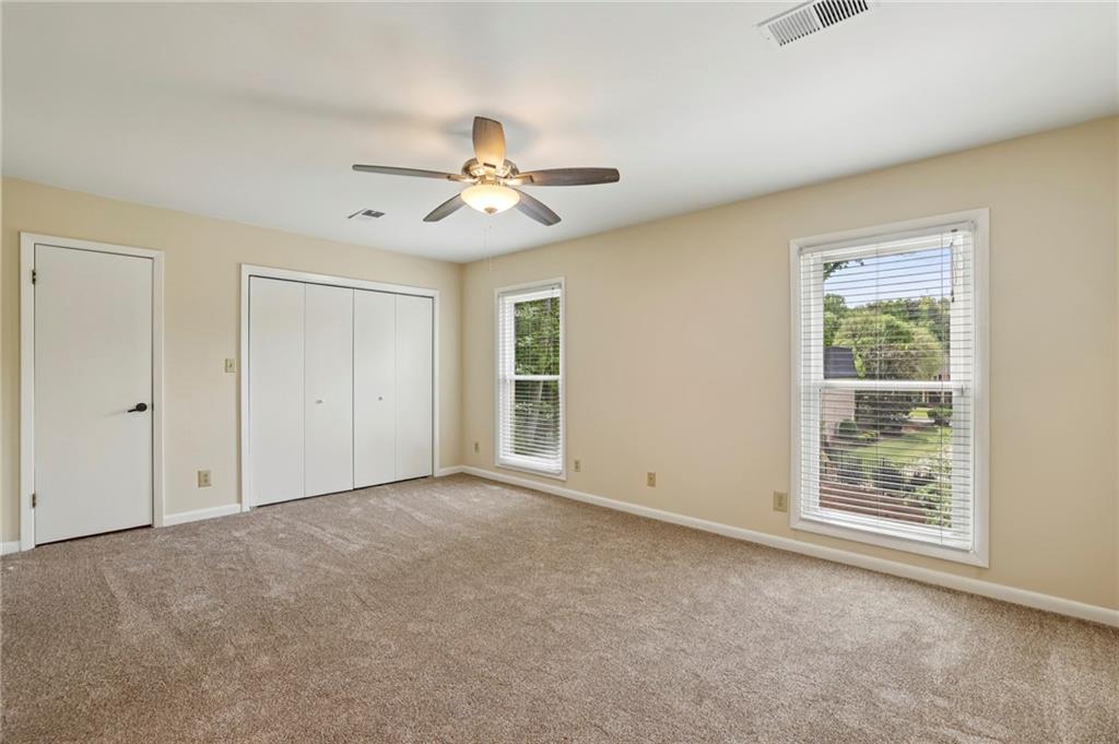 1843 Vancroft Court Atlanta, GA 30338 - Photo 24 of 46 an empty room with windows and fan