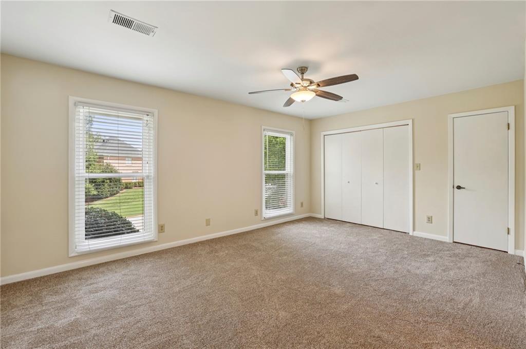 1843 Vancroft Court Atlanta, GA 30338 - Photo 25 of 46 an empty room with windows and fan