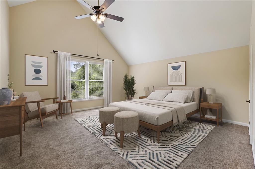1843 Vancroft Court Atlanta, GA 30338 - Photo 28 of 46 a spacious bedroom with a bed a couch and a window