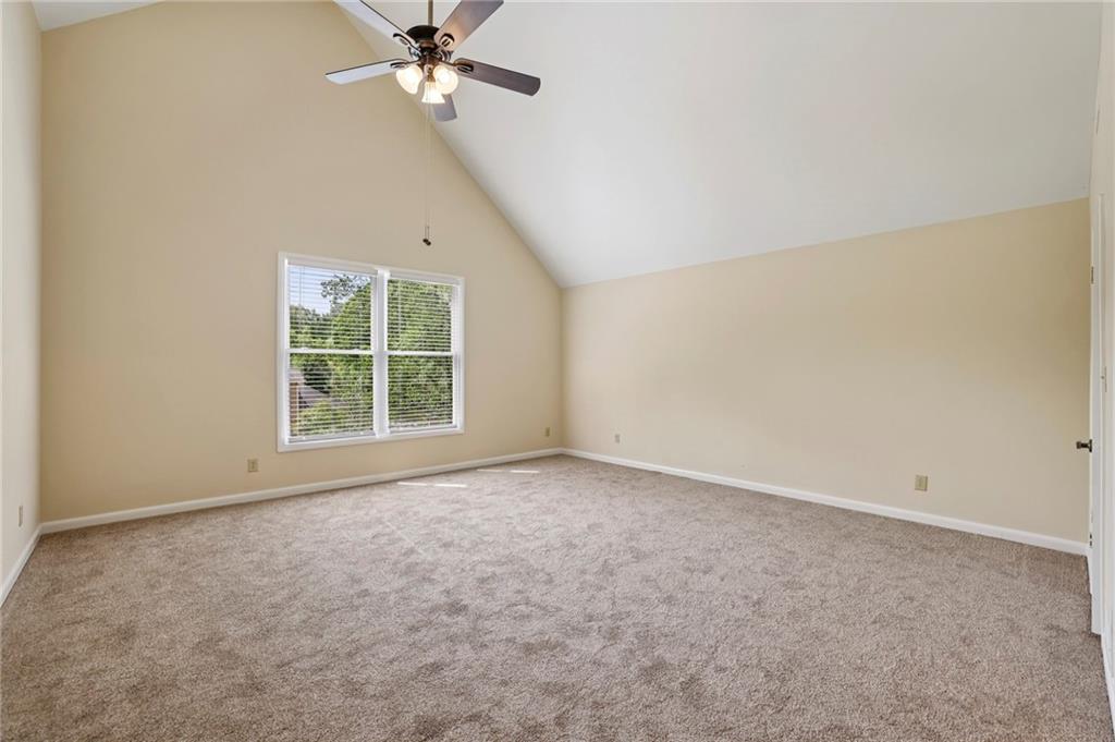 1843 Vancroft Court Atlanta, GA 30338 - Photo 29 of 46 an empty room with a window and a fan