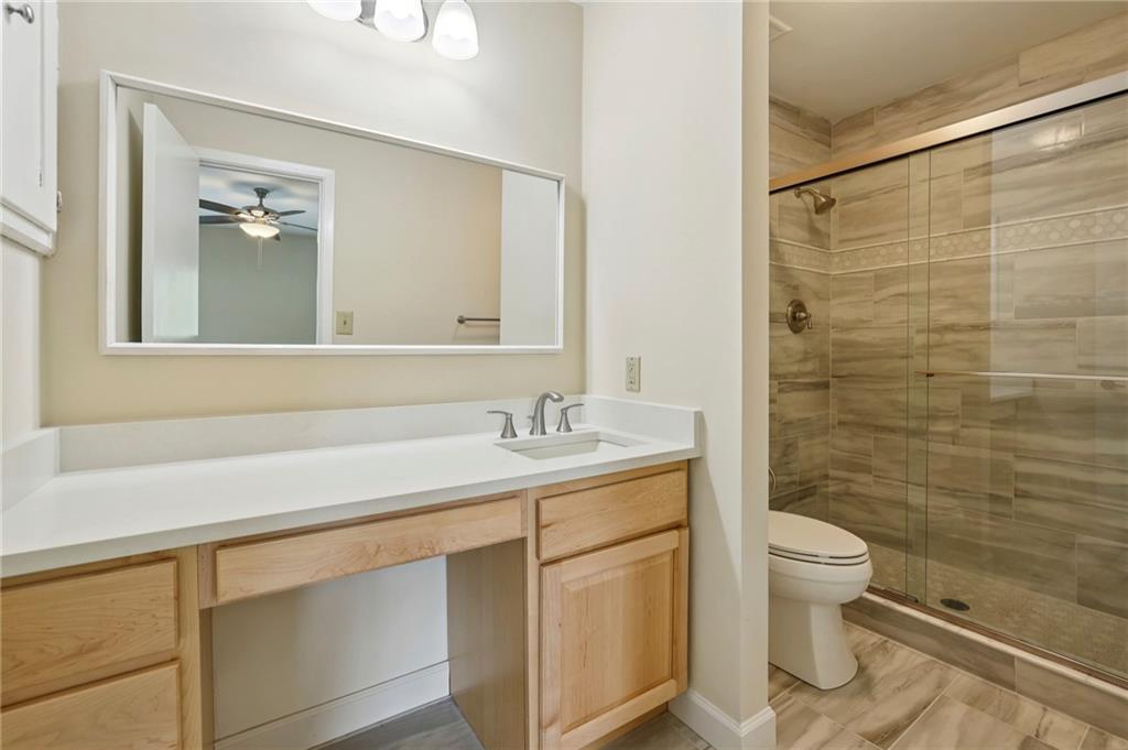 1843 Vancroft Court Atlanta, GA 30338 - Photo 31 of 46 a bathroom with a sink a toilet and shower