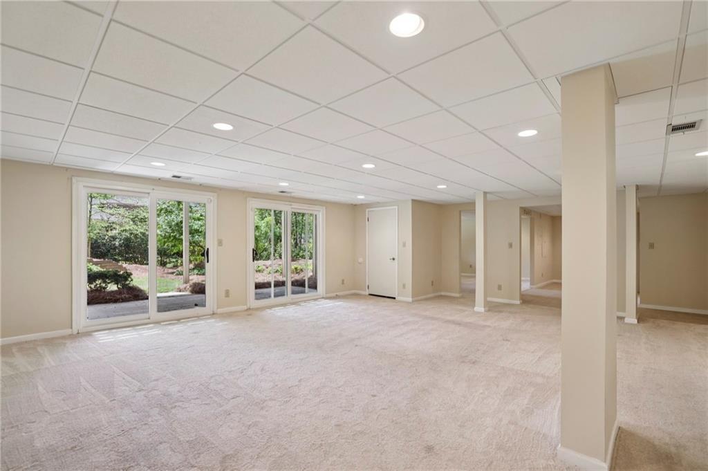 1843 Vancroft Court Atlanta, GA 30338 - Photo 35 of 46 a view of an empty room with large windows