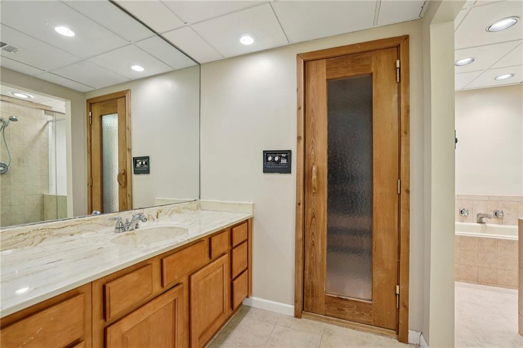 1843 Vancroft Court Atlanta, GA 30338 - Photo 36 of 46 a bathroom with a granite countertop sink mirror and double