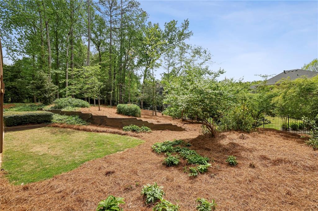 1843 Vancroft Court Atlanta, GA 30338 - Photo 41 of 46 a view of a field with trees in the background