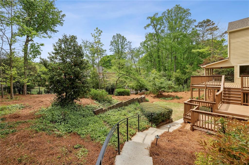 1843 Vancroft Court Atlanta, GA 30338 - Photo 44 of 46 a view of a backyard with plants and lake view
