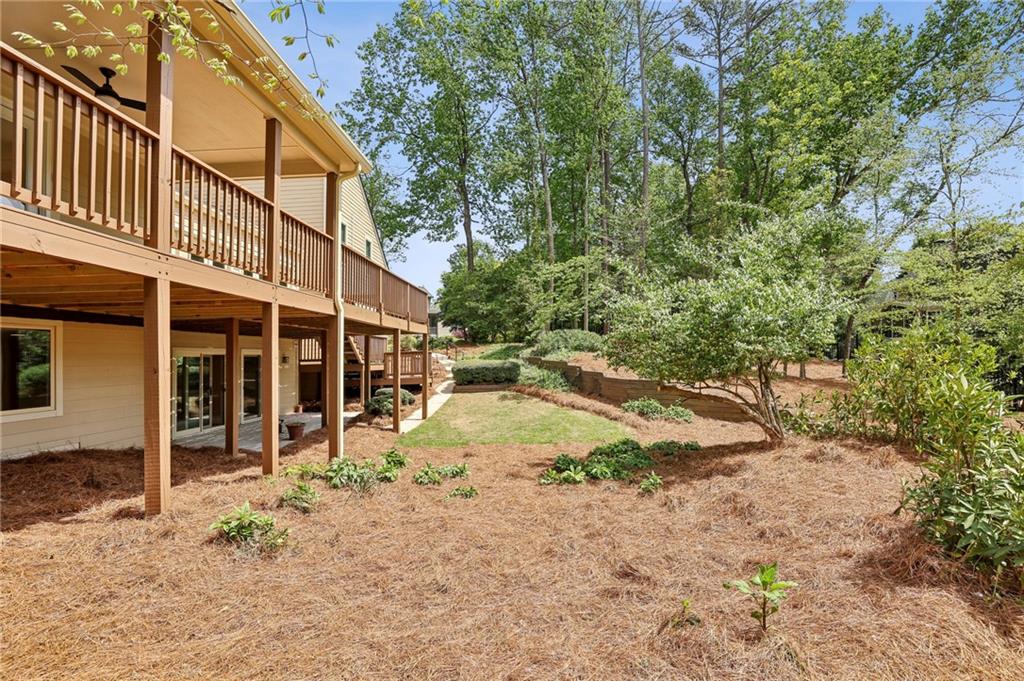 1843 Vancroft Court Atlanta, GA 30338 - Photo 45 of 46 a view of a house with backyard and sitting area