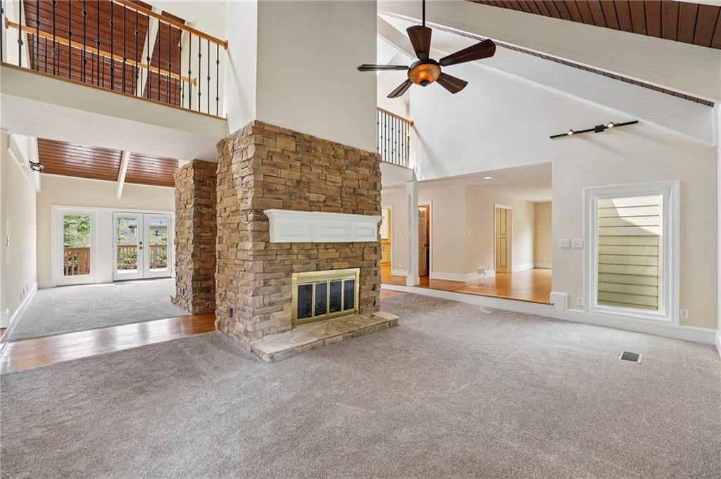 1843 Vancroft Court Atlanta, GA 30338 - Photo 6 of 46 a view of a livingroom with a fireplace and windows