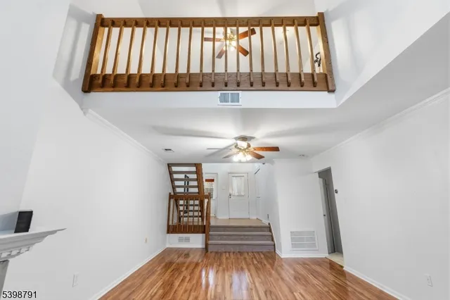 a view of entryway with wooden floor