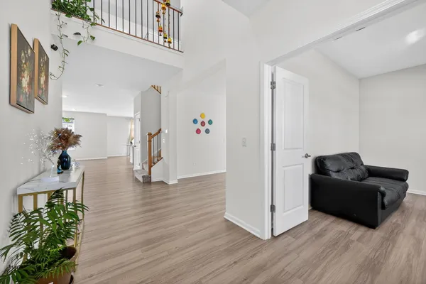 a living room with furniture and a potted plant