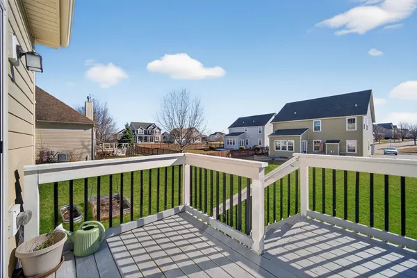 a view of a balcony with yard