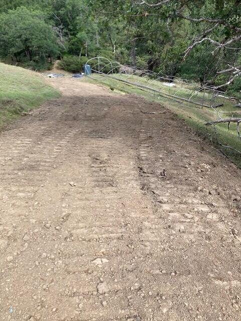395 East Van Duzen Road Bridgeville, CA 95526 - Photo 12 of 19 a view of a dirt road with a building