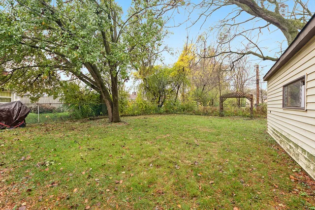a backyard of a house with lots of green space