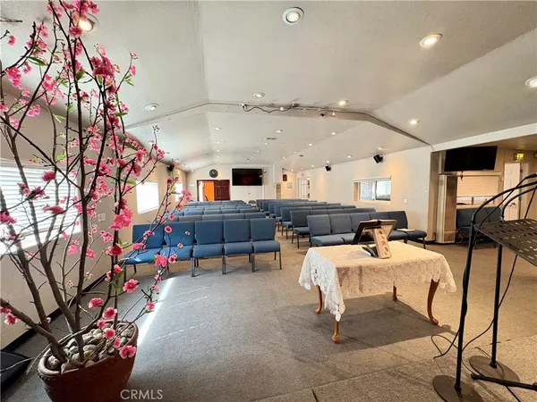 a living room with furniture and a chair