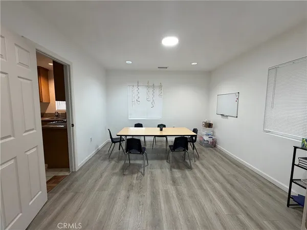 a kitchen with a sink and a stove top oven