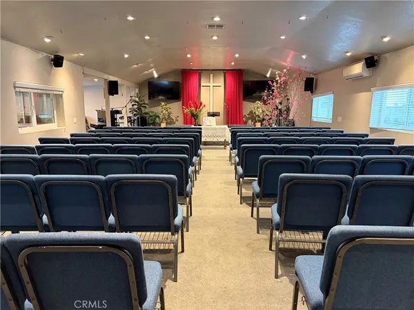 a lobby with furniture and stairs