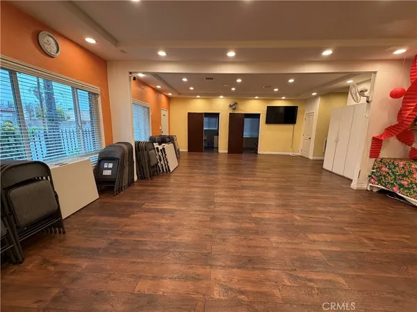 a room with furniture a window and a wooden floor