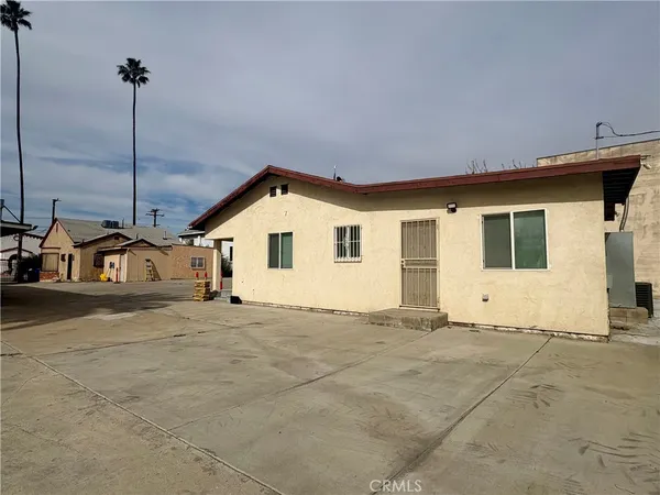 a view of a house with a snow in the yard