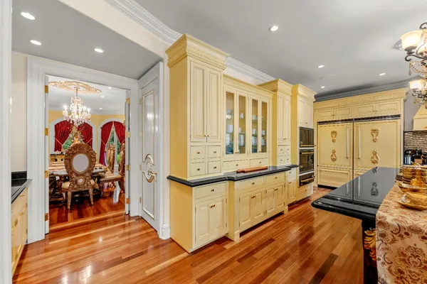 a view of walk in closet with clothes