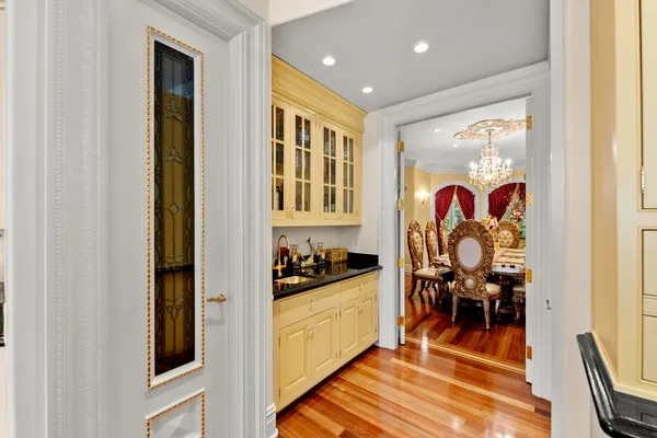 a large bathroom with a sink a large mirror and a bathtub next to a window