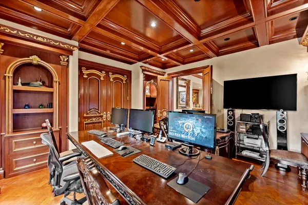 an aerial view of a house with a swimming pool