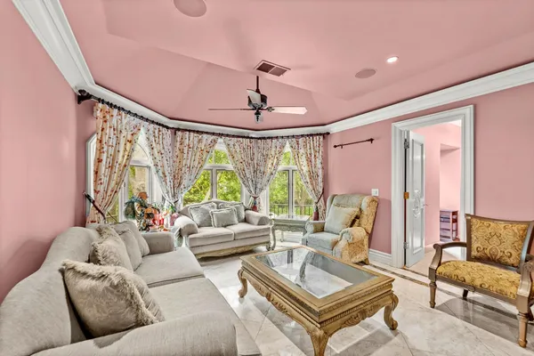 a front view of a house with a yard and trees