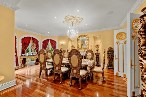 a kitchen with stainless steel appliances kitchen island granite countertop a refrigerator a stove top oven and a sink