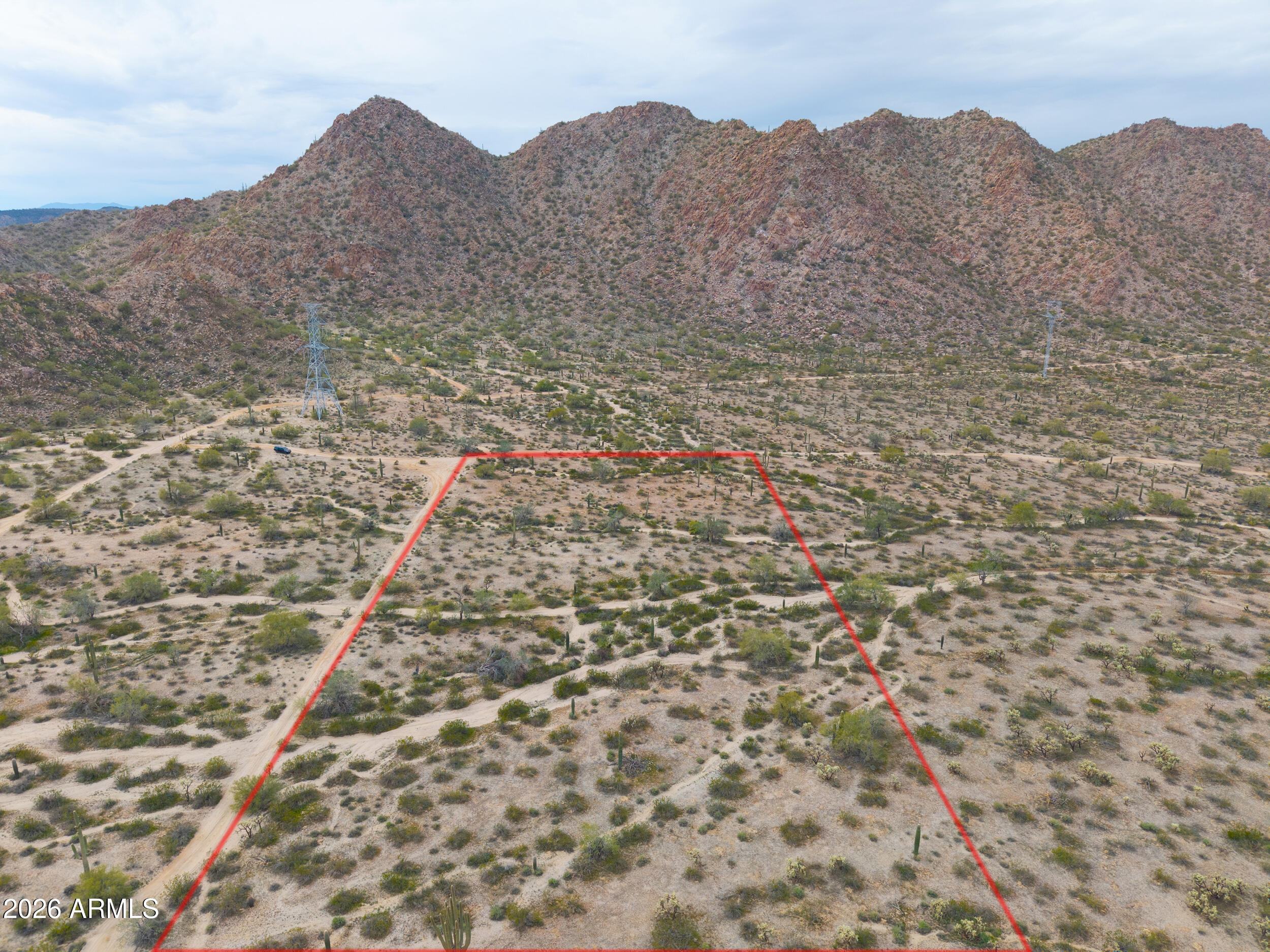 0 West Robin Road Maricopa, AZ 85139 - Photo 12 of 27 a view of a dry yard with mountains in the background