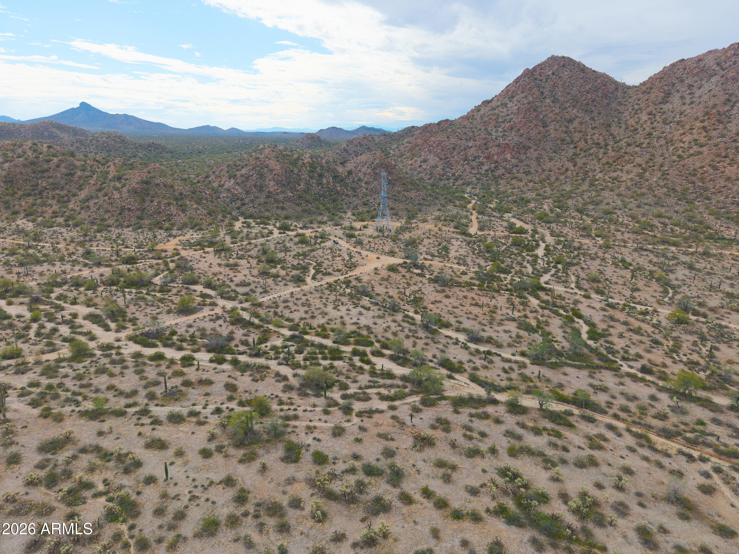 0 West Robin Road Maricopa, AZ 85139 - Photo 22 of 27 a view of a dry yard with mountains in the background