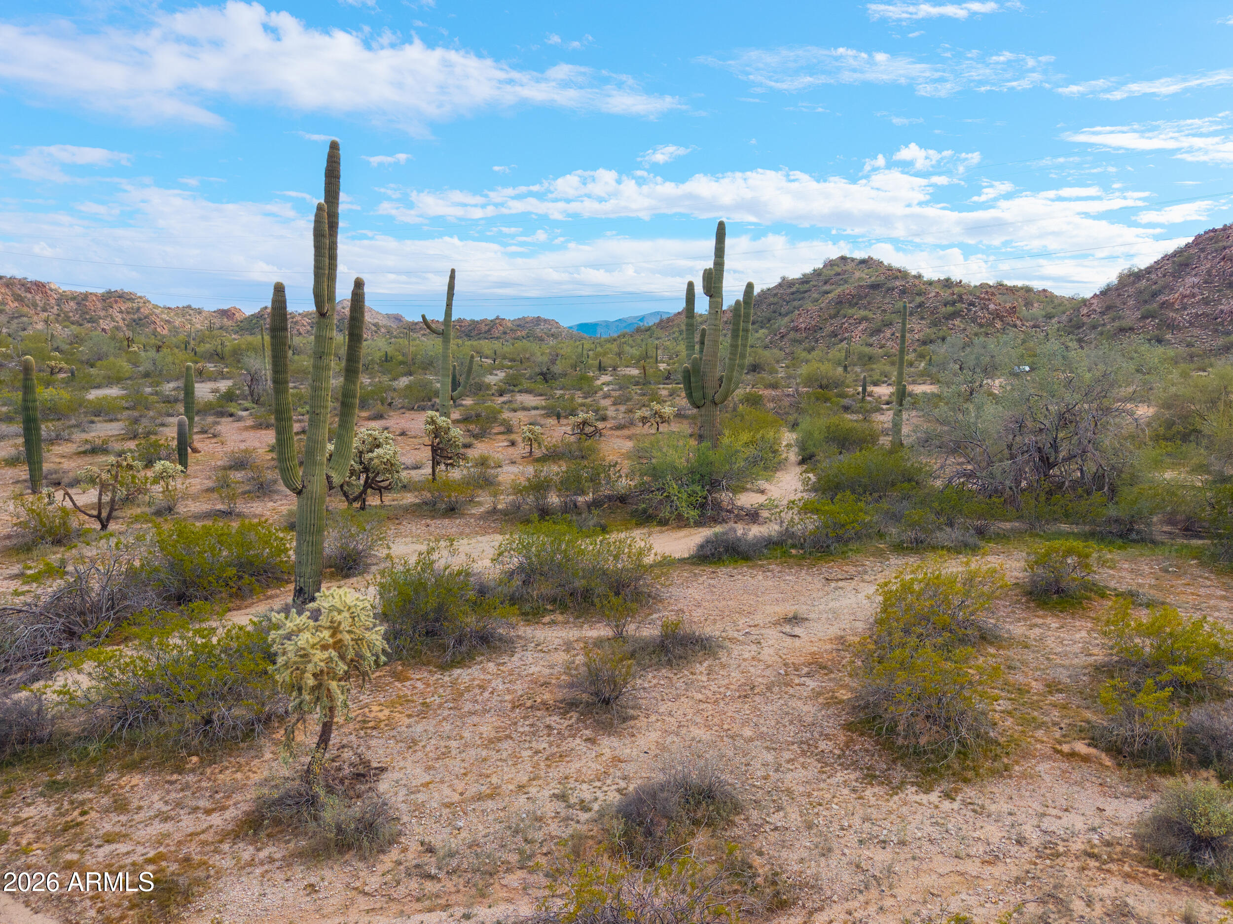0 West Robin Road Maricopa, AZ 85139 - Photo 6 of 27 a view of a lake with mountains in the background