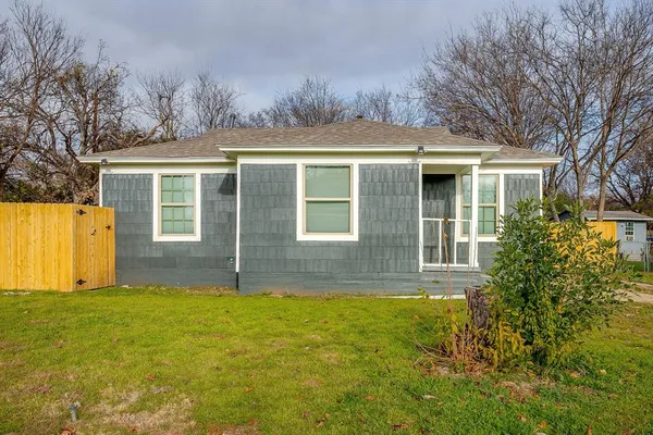 front view of a house with a yard