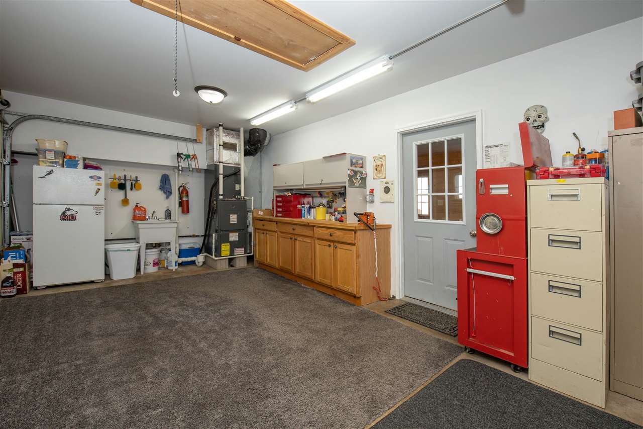 7372 North River Road Byron, IL 61010 - Photo 26 of 40 a view of a storage & utility room with fridge and closet
