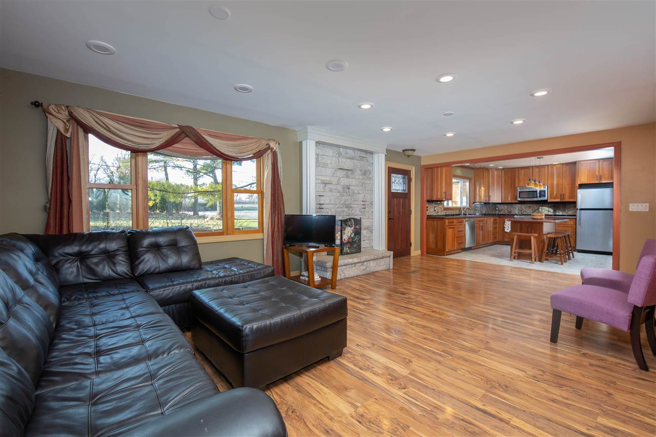 7372 North River Road Byron, IL 61010 - Photo 3 of 40 a living room with furniture and a wooden floor