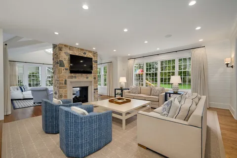 a view of a patio with a table chairs and a backyard