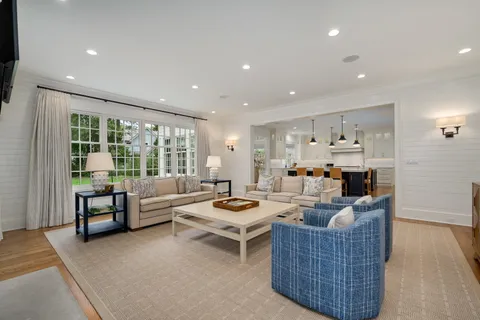 a view of a hallway with seating space