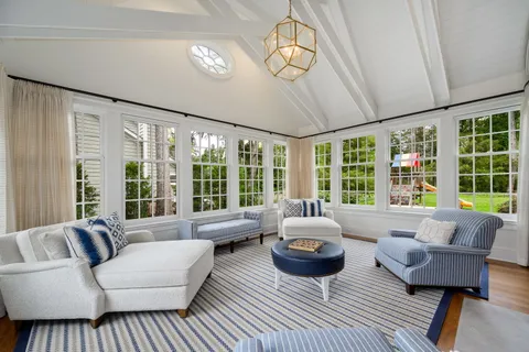 a spacious bedroom with a bed and a couch