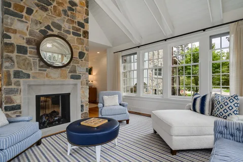 a spacious bathroom with double vanity and a large mirror