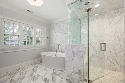 an empty room with furniture and a ceiling fan