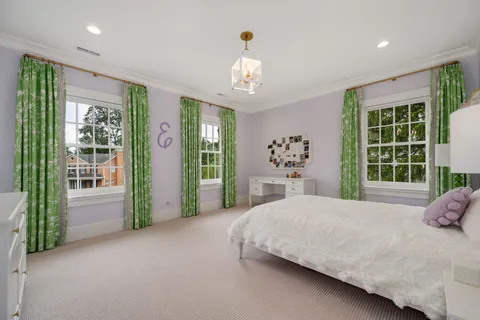 a bed room with a bed and a window