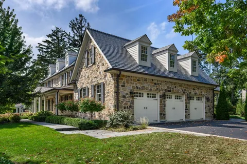 a view of a workspace with furniture and a potted plant