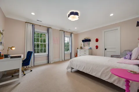 a view of a grassy field with trees