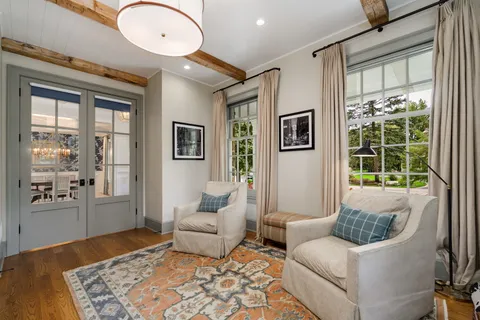 a large kitchen with granite countertop a counter top space a sink stainless steel appliances and cabinets