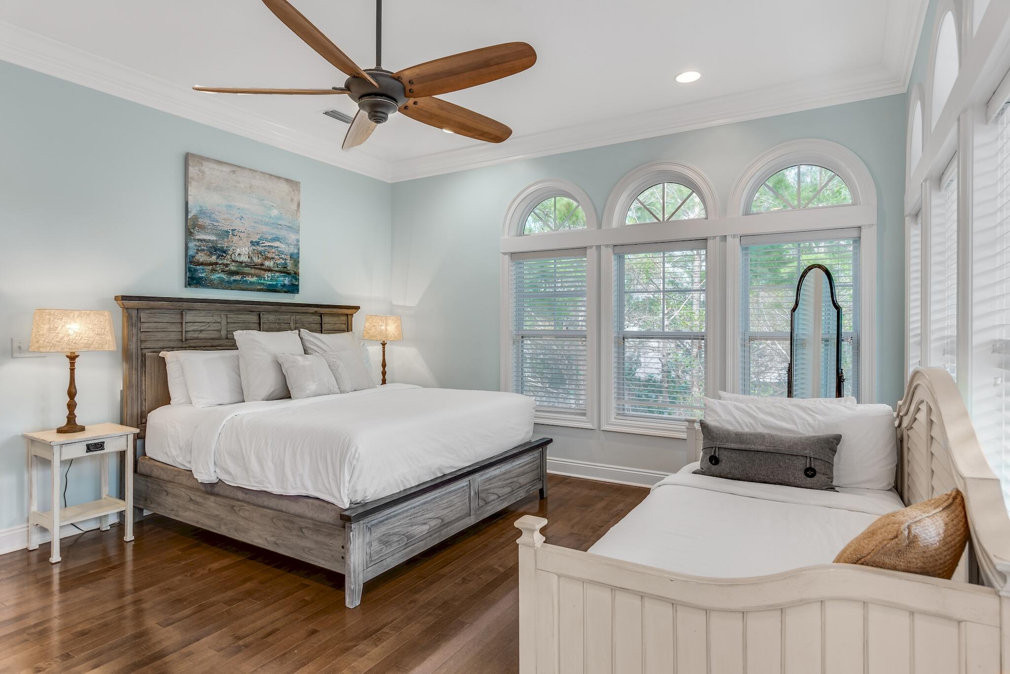 55 The Greenway Loop Panama City Beach, FL 32461 - Photo 16 of 32 a bedroom with furniture and a large window